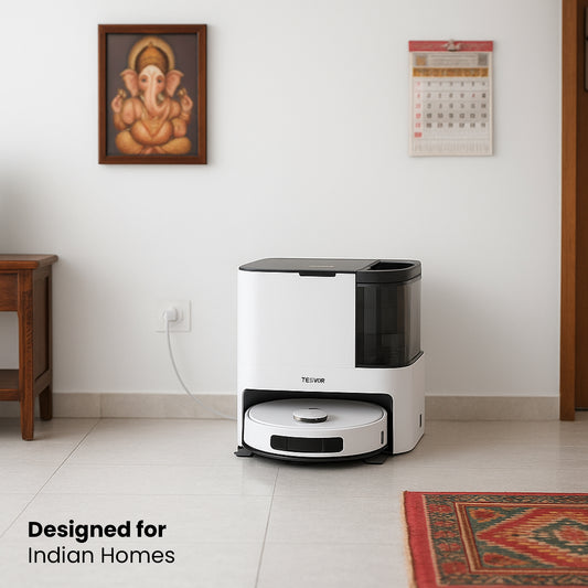 Robotic vacuum cleaner in a room with a wall painting and calendar.